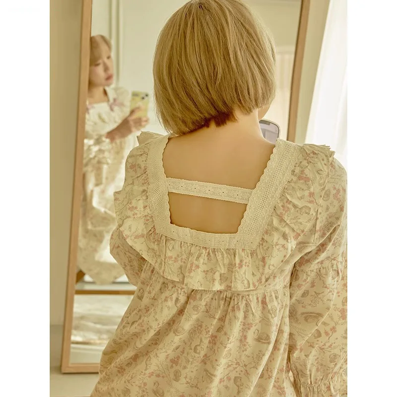 Back view of vintage pink floral nightgown with gathered sleeves