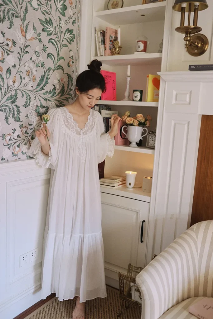 White cotton lace nightgown with layered sleeves and ruffled hem