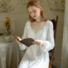 White Cotton Nightgown – Romantic Lifestyle View White long-sleeve cotton nightgown in a romantic interior